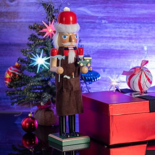 Оревозак на производител на божиќни играчи - црвена и зелена дрвена оревчеста човек со кафеави работници престилка и играчки за играчки и играчки