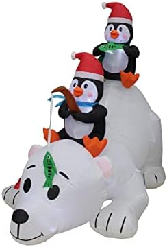 Два божиќни украси за украси, вклучуваат божиќни пингвини со должина од 6 нозе, риболов на поларна мечка, и 12 нозе долг Божиќ на надувување Дедо